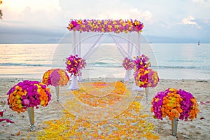 Beautiful wedding arch on the beach .