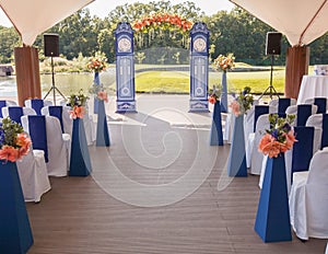 Beautiful wedding archway. Arch like clocks decorated with peachy flowers