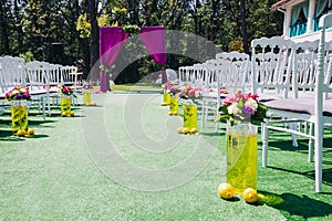 Beautiful wedding archway with chairs on on each side