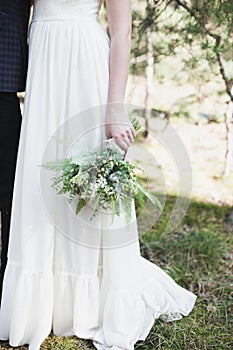 Beautiful wedding bouquet in bride's hands