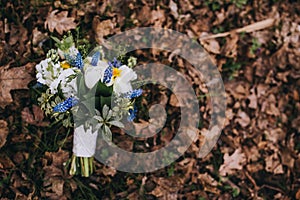 Beautiful wedding bouquet of different white, blue, green flower