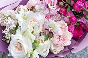 Beautiful wedding bouquet, flowers arrangement by florist with white and pink roses and lilac close up