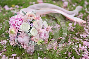 Beautiful wedding bouquet on the grass