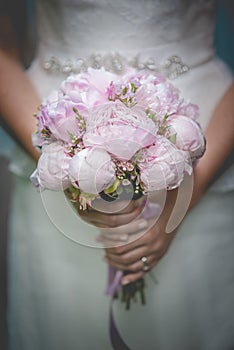 Beautiful wedding bouquet in hands of the bride