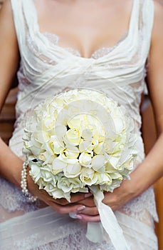 Beautiful wedding bouquet in hands of the bride. Focus