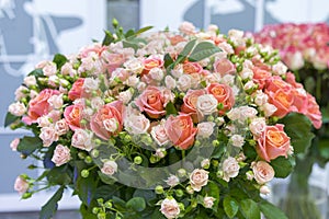 Beautiful wedding bouquet in hands of the bride. beautiful bouquet of roses