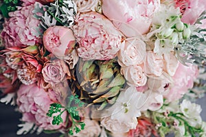 Beautiful wedding bouquet of spring flowers in pastel tones