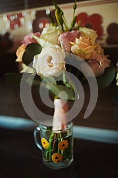 Beautiful wedding bouquet. Stylish wedding bouquet bride of pink roses, white carnation, green flowers