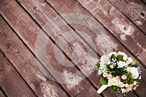 Beautiful wedding bouquet on vintage wooden background. Marriage concept