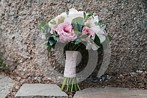 Beautiful wedding bouquet of white and pink peony and roses.