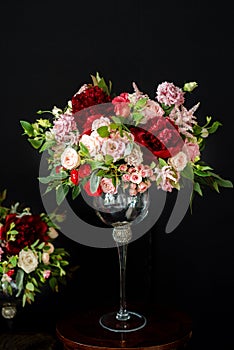 Beautiful wedding bouquets of the bride and girlfriend of the bride on a dark background