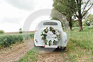 Beautiful wedding car with plate JUST MARRIED photo