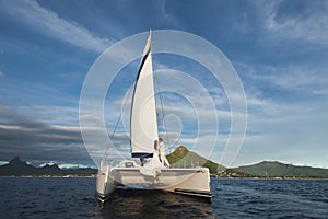 Beautiful wedding couple bride and groom on yacht at wedding day outdoors in the sea. Happy marriage couple kissing on