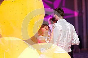 Beautiful wedding couple dance in restaurant