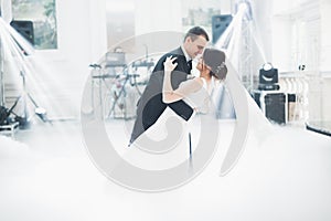 Beautiful wedding couple just married and dancing their first dance