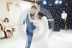 Beautiful wedding couple just married and dancing their first dance