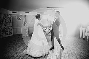 Beautiful wedding couple just married and dancing their first dance