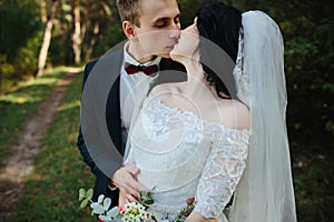 Beautiful wedding couple kissing