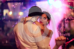 Beautiful wedding dance in soap bubbles, blurred