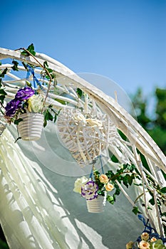 Beautiful wedding decor heart and flowers on the arch