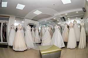 Beautiful wedding dresses in wedding atelier, fisheye effect