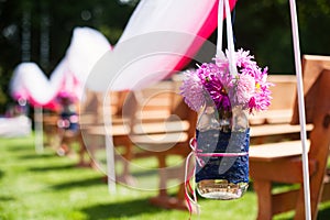 Beautiful wedding flower arrangement of seats on ceremony