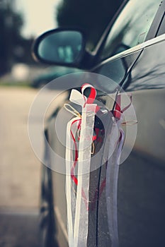 Beautiful wedding ribbons on a car