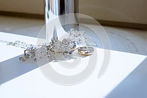 Beautiful wedding rings and perfume bottle for bride and groom