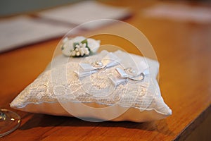 Beautiful wedding rings on ring barer pillow