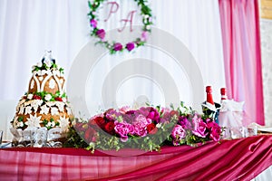 Beautiful wedding set decoration in the restaurant. Flowers on table of newlywed