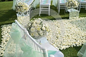 Beautiful wedding set up.Wedding ceremony on green lawn in the photo