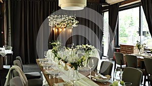 a beautiful wedding table with decor of flowers food and drinks for an banquet in the restaurant