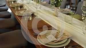 a beautiful wedding table with decor of flowers food and drinks for an banquet in the restaurant