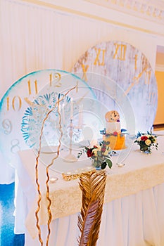 Beautiful wedding table decorated with flowers. Wedding cake. Sweets