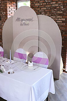 Beautiful wedding table set with purple decorations and lavender