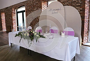 Beautiful wedding table set with purple decorations and lavender