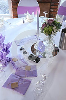 Beautiful wedding table set with purple decorations and lavender