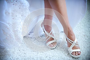 Beautiful wedding white shoes under the skirt