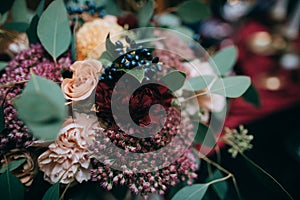 Beautiful weding table decoration with red fresh flowers and candles