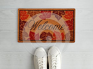 Beautiful Welcome entry Mapple Leaves designer doormat with white sneaker shoes