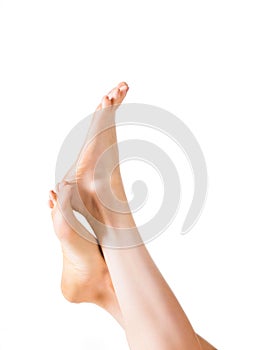 Beautiful well-groomed female a foot and a heel isolated on a white background.
