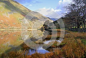 Beautiful Welsh Mountains reflected in a still waters of lake Llyn Gwynant