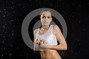 Beautiful wet girl in white under rain