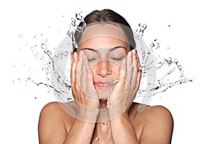 Beautiful wet woman face with water drop photo