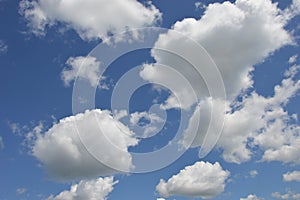 Beautiful whimsical white clouds against the blue daytime sky. Natural background