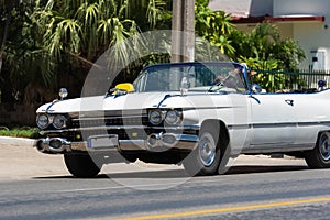 Beautiful white american classic cabriolet car in the front view in Varadero Cuba