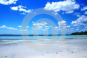 Beautiful white beach and blue Caribbean sky