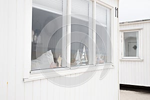 The beautiful white beach cabins at Blokhus Beach in Denmark