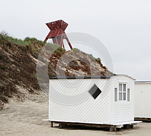 The beautiful white beach cabins at Blokhus Beach in Denmark