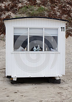 The beautiful white beach cabins at Blokhus Beach in Denmark